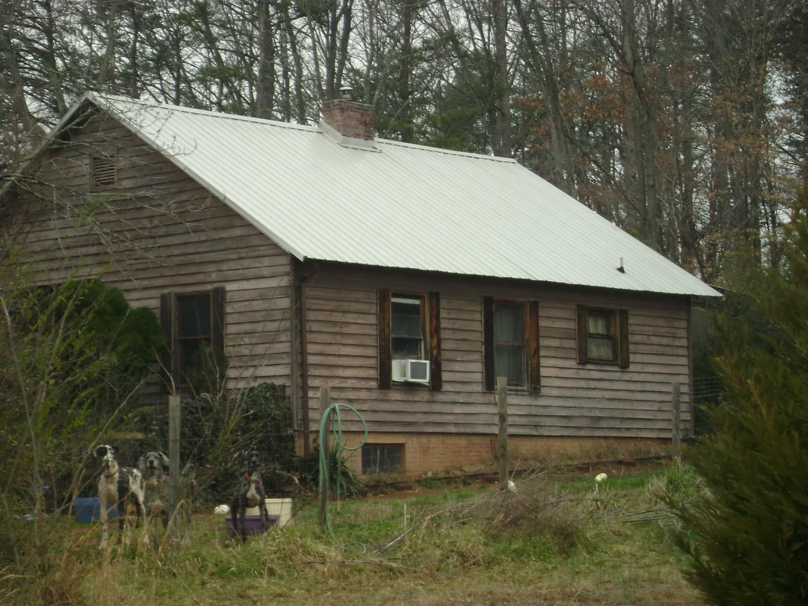 White metal roof on an old wood sided farmhouse, from a Metal Roof Installation job in Blue Ridge Summit